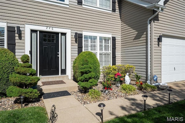 entrance to property featuring a garage