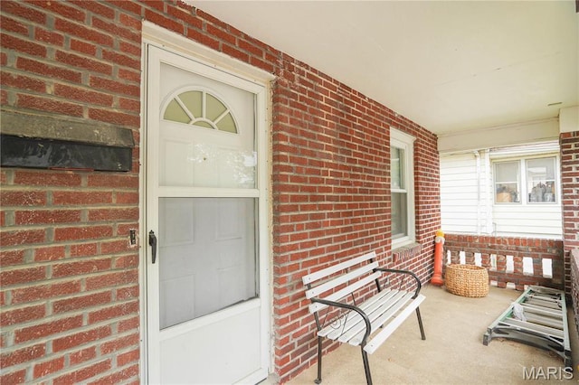 9969 Lark Ave, Saint Louis, MO 63125 - entrance to property featuring covered porch and brick siding