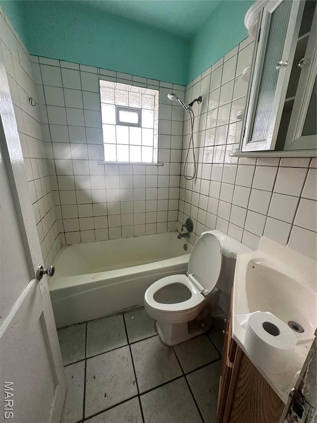 9969 Lark Ave, Saint Louis, MO 63125 - full bathroom featuring vanity,  shower combination, tile patterned floors, and tile walls