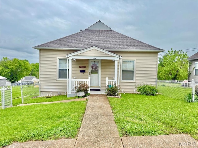 815 Stewart St, De Soto, MO 63020 - view of front facade featuring a shingled roof and covered porch
