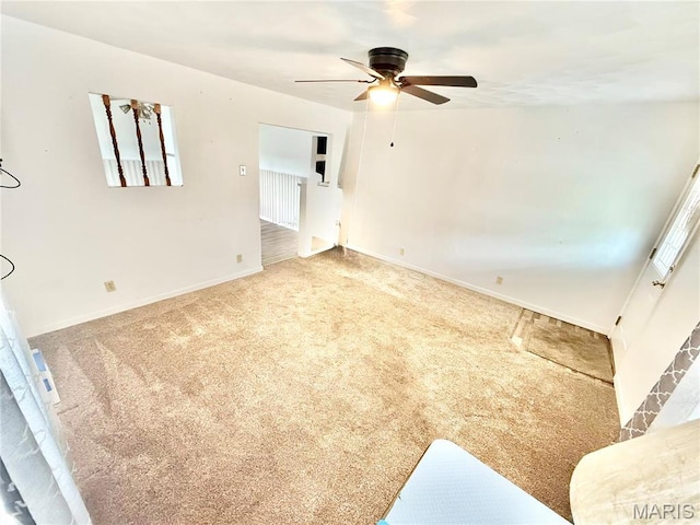 815 Stewart St, De Soto, MO 63020 - unfurnished living room featuring ceiling fan, carpet floors, and baseboards