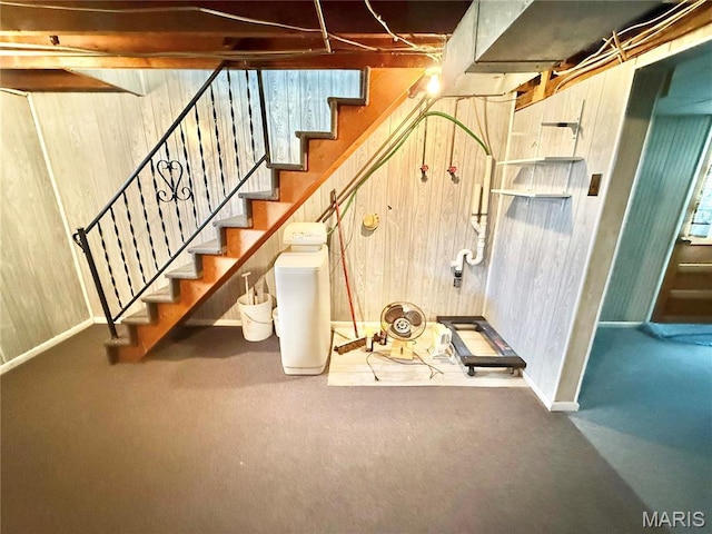 815 Stewart St, De Soto, MO 63020 - staircase with wooden walls and baseboards