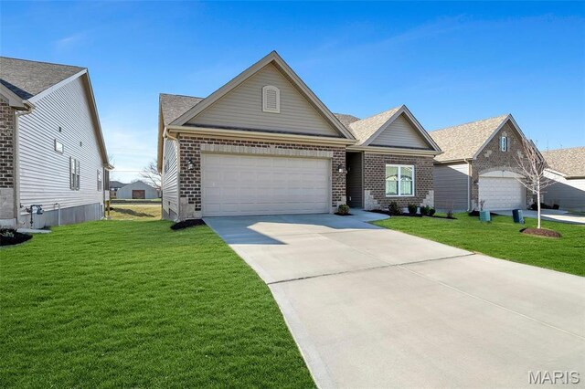 116 Dardenne Place Dr, Dardenne Prairie, MO 63368 - view of front of home with brick siding, driveway, a front lawn, and an attached garage