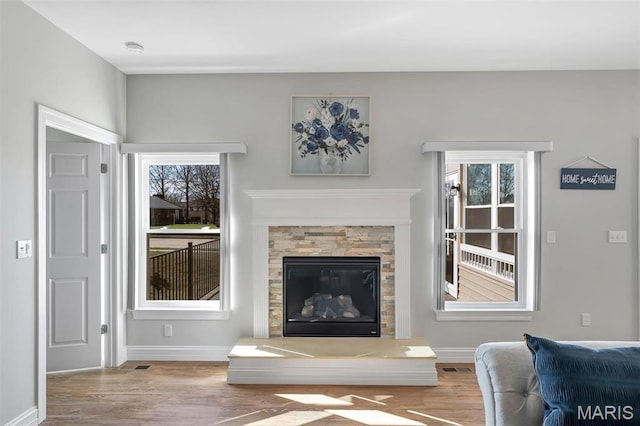 116 Dardenne Place Dr, Dardenne Prairie, MO 63368 - living area with wood finished floors, baseboards, and healthy amount of natural light
