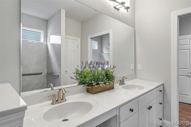 116 Dardenne Place Dr, Dardenne Prairie, MO 63368 - bathroom with plenty of natural light, double vanity, and wood finished floors