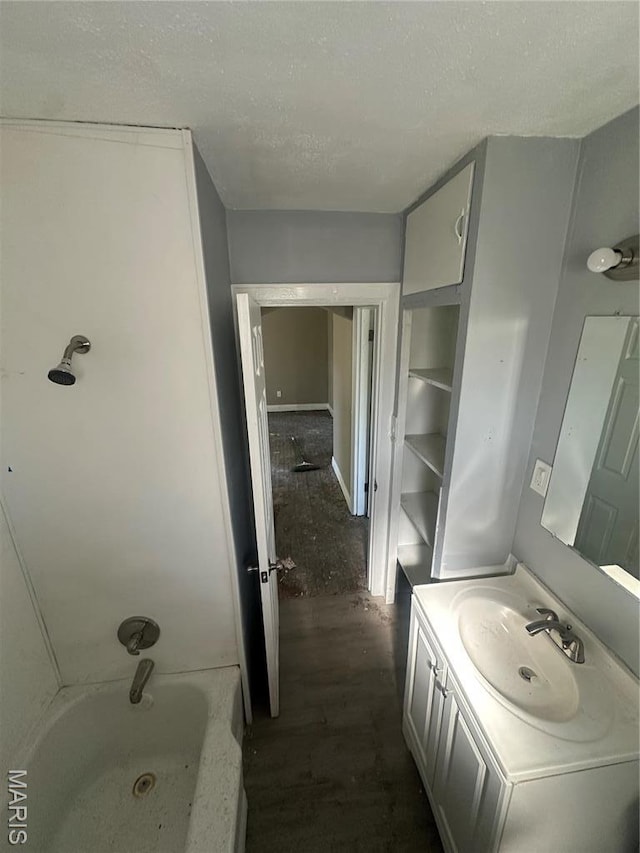 357 Fork Dr, Saint Louis, MO 63137 - bathroom featuring vanity, wood finished floors, and a textured ceiling