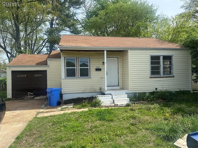 737 Charbonier Rd, Florissant, MO 63031 - bungalow-style home featuring driveway, an attached garage, and a shingled roof