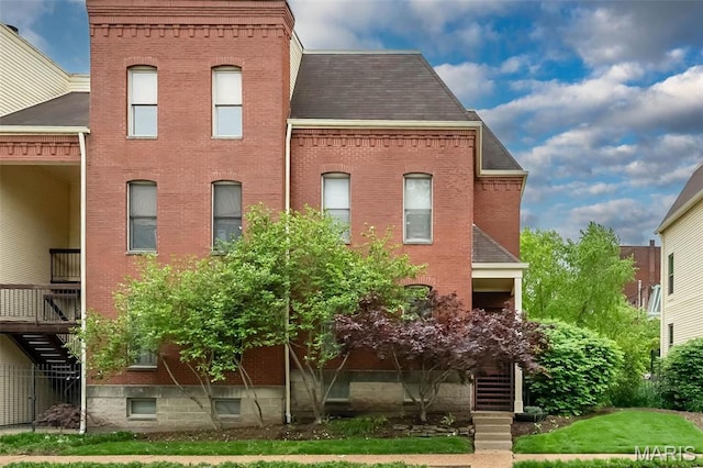 1040 Carroll St Unit 6, Saint Louis, MO 63104 - back of house with stairs, brick siding, and roof with shingles