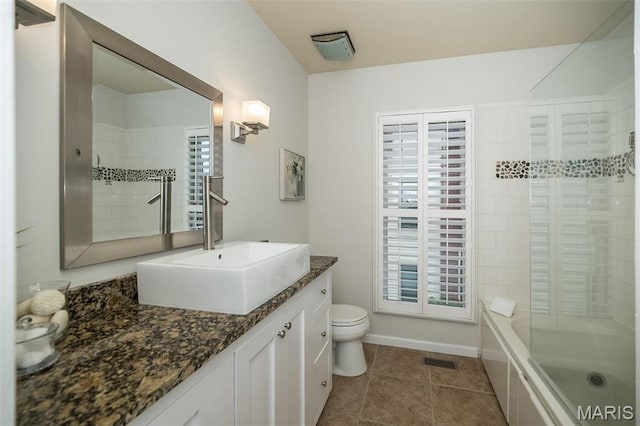 1040 Carroll St Unit 6, Saint Louis, MO 63104 - bathroom with toilet, tile patterned floors, vanity, shower / tub combination, and baseboards