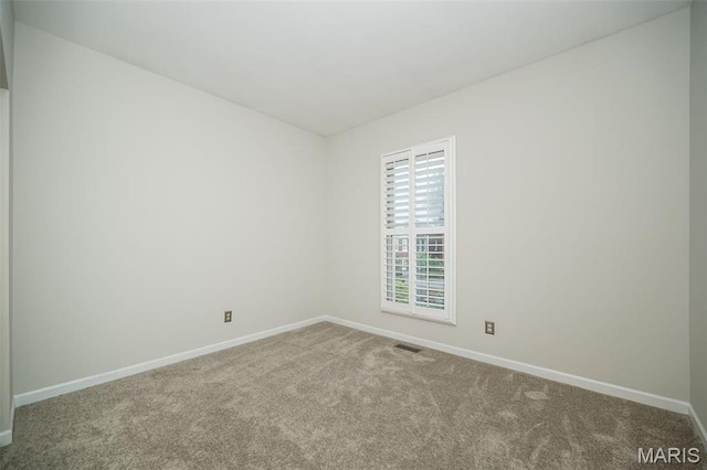 1040 Carroll St Unit 6, Saint Louis, MO 63104 - carpeted spare room featuring baseboards