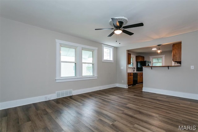514 Hamilton Ave, Wood River, IL 62095 - unfurnished living room featuring baseboards, dark wood-style floors, and ceiling fan