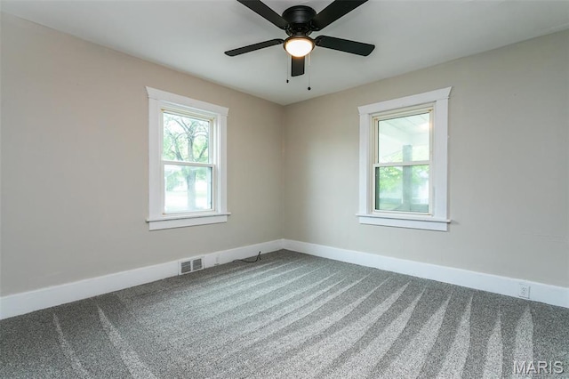 514 Hamilton Ave, Wood River, IL 62095 - unfurnished room featuring carpet flooring, baseboards, and a ceiling fan