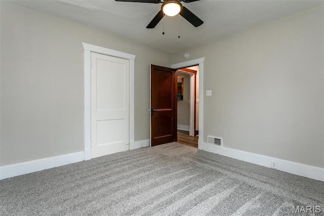 514 Hamilton Ave, Wood River, IL 62095 - empty room featuring carpet floors, ceiling fan, and baseboards