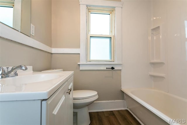 514 Hamilton Ave, Wood River, IL 62095 - full bathroom with baseboards, healthy amount of natural light, wood finished floors, and toilet