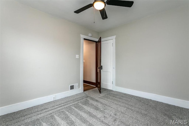 514 Hamilton Ave, Wood River, IL 62095 - spare room featuring carpet, a ceiling fan, and baseboards