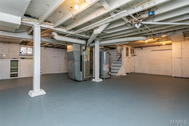 514 Hamilton Ave, Wood River, IL 62095 - unfinished below grade area featuring gas water heater, stairs, and heating unit