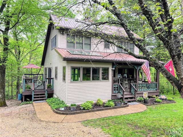 9398 Carol Dr, Bonne Terre, MO 63628 - view of front facade with metal roof, a front yard, and a deck