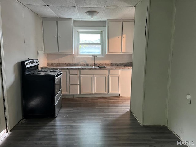 2123 Rosebud Ave, Hillsdale, MO 63121 - kitchen featuring stainless steel electric stove, a sink, a drop ceiling, dark wood-style flooring, and white cabinetry