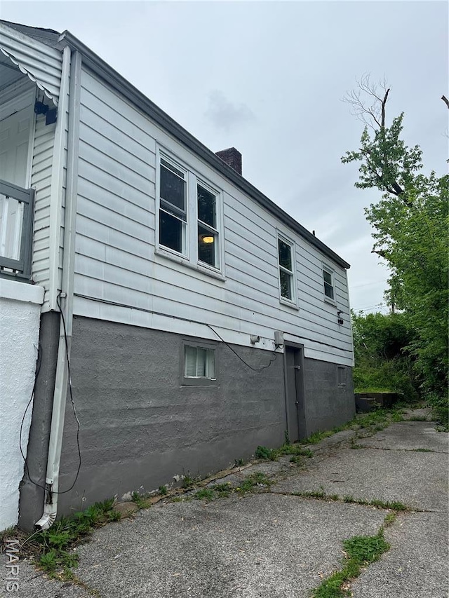 2123 Rosebud Ave, Hillsdale, MO 63121 - view of home's exterior featuring a chimney