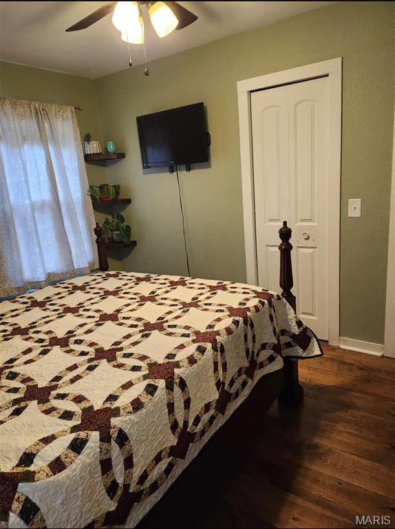 bedroom featuring wood finished floors, ceiling fan, and baseboards