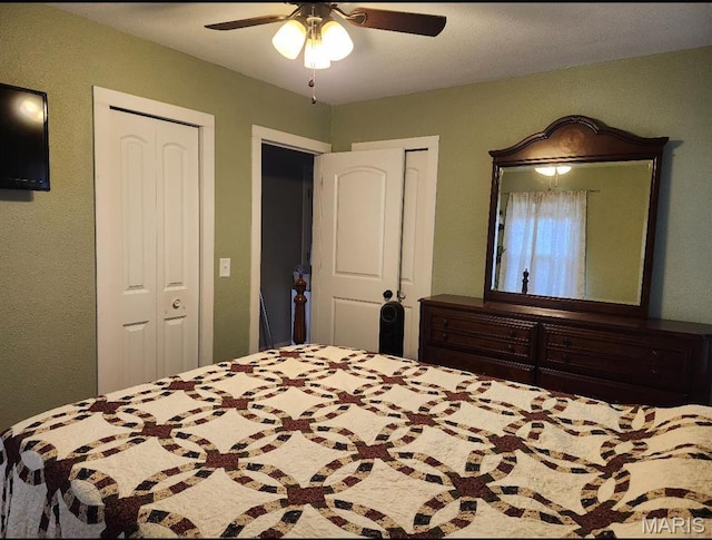 bedroom with a ceiling fan and a closet