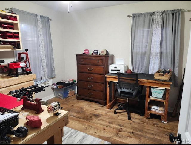 office area with wood-type flooring and baseboards
