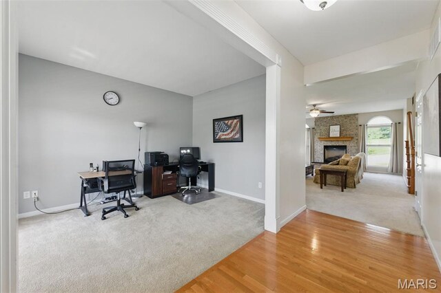 65 Snowberry Ridge Ct, Ofallon, MO 63366 - carpeted office space featuring baseboards, a fireplace, wood finished floors, and ceiling fan