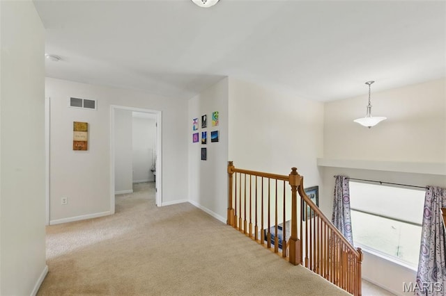 65 Snowberry Ridge Ct, Ofallon, MO 63366 - hallway with an upstairs landing, carpet floors, and baseboards