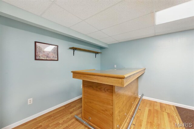 65 Snowberry Ridge Ct, Ofallon, MO 63366 - bar area with baseboards, wood finished floors, and a paneled ceiling
