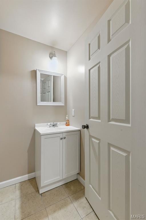 65 Snowberry Ridge Ct, Ofallon, MO 63366 - bathroom featuring baseboards, tile patterned floors, and vanity