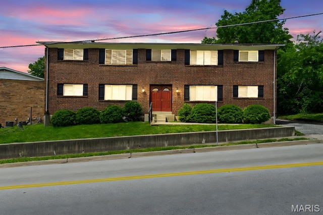 3401 Droste Rd, Saint Charles, MO 63301 - view of front facade with a front lawn and brick siding