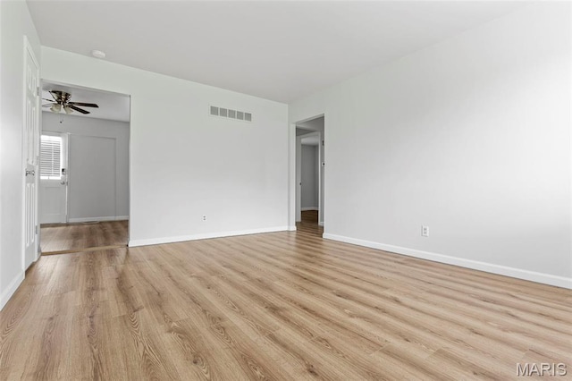 3401 Droste Rd, Saint Charles, MO 63301 - unfurnished room with light wood-style flooring, baseboards, a smoke detector, and a ceiling fan