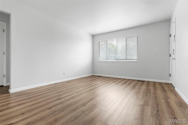 3401 Droste Rd, Saint Charles, MO 63301 - unfurnished room with wood finished floors and baseboards