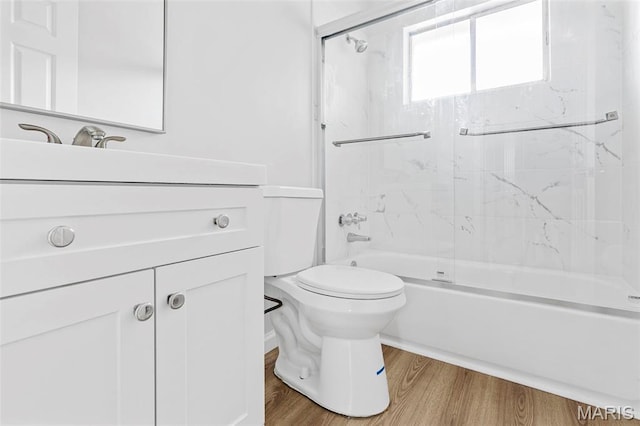 3401 Droste Rd, Saint Charles, MO 63301 - full bathroom featuring toilet, wood finished floors, vanity, and shower / bath combination