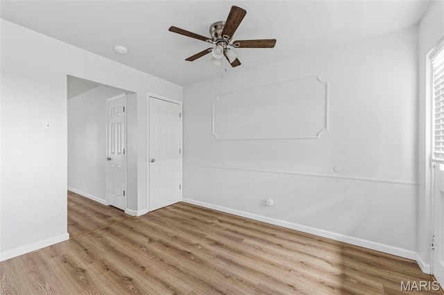 3401 Droste Rd, Saint Charles, MO 63301 - spare room with baseboards, wood finished floors, a ceiling fan, and a smoke detector