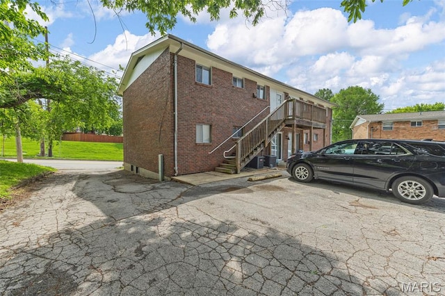 3401 Droste Rd, Saint Charles, MO 63301 - back of property featuring brick siding and stairway