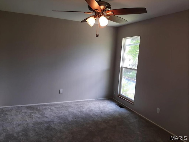 574 Coach Light Ln, Hazelwood, MO 63042 - empty room with carpet, ceiling fan, and baseboards