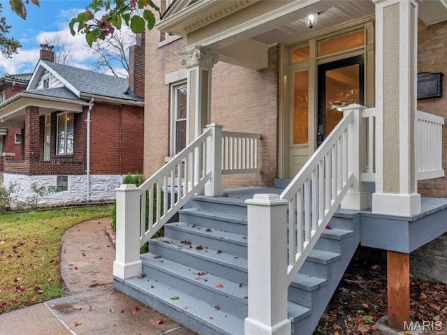 2907 S Kingshighway Blvd, Saint Louis, MO 63139 - view of exterior entry featuring brick siding and a shingled roof