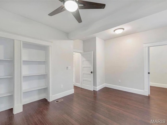 2907 S Kingshighway Blvd, Saint Louis, MO 63139 - unfurnished bedroom with baseboards, wood finished floors, and ceiling fan