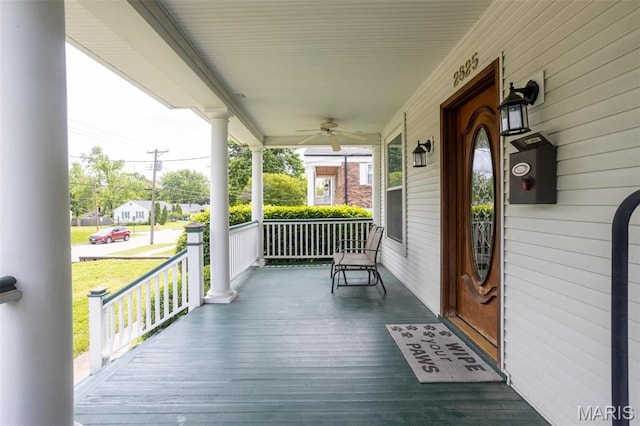 deck featuring covered porch and a ceiling fan