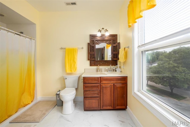 full bath with marble look tile flooring, vanity, toilet, baseboards, and a shower with curtain