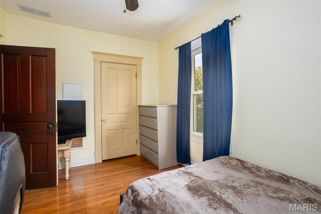 bedroom with wood finished floors