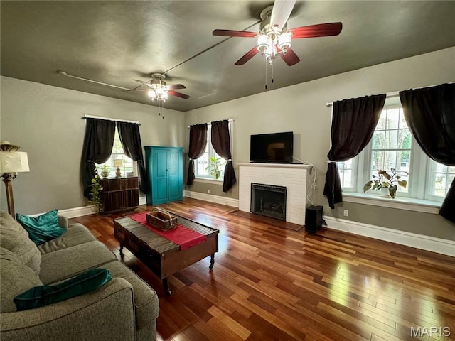 149 N Elizabeth Ave, Saint Louis, MO 63135 - living area with wood finished floors, baseboards, and ceiling fan