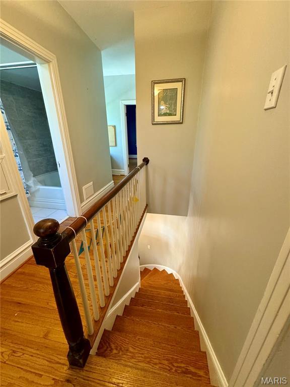 149 N Elizabeth Ave, Saint Louis, MO 63135 - stairs featuring wood finished floors