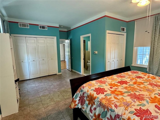 149 N Elizabeth Ave, Saint Louis, MO 63135 - bedroom featuring multiple closets, baseboards, and connected bathroom