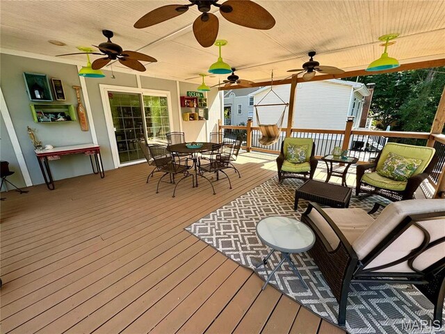 149 N Elizabeth Ave, Saint Louis, MO 63135 - wooden deck featuring a ceiling fan, outdoor dining space, and an outdoor living space