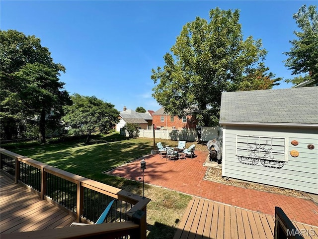 149 N Elizabeth Ave, Saint Louis, MO 63135 - wooden deck with a patio