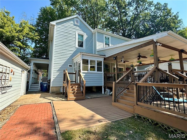149 N Elizabeth Ave, Saint Louis, MO 63135 - back of house with a ceiling fan, a wooden deck, and stairs