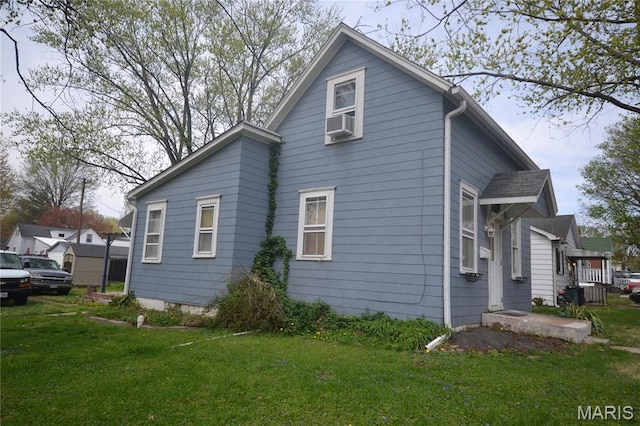 103 N Delaware Ave, Belleville, IL 62221 - view of home's exterior featuring a yard