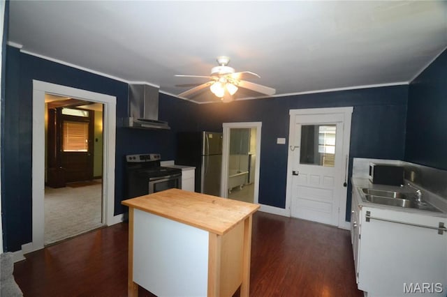 103 N Delaware Ave, Belleville, IL 62221 - kitchen with appliances with stainless steel finishes, wall chimney exhaust hood, butcher block counters, dark wood-style floors, and ornamental molding